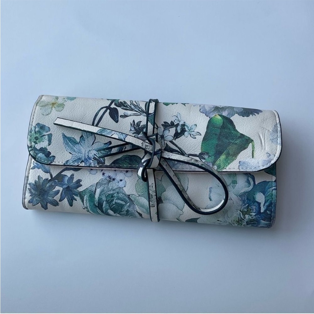 Floral makeup roll with 3 zip compartments and tie front